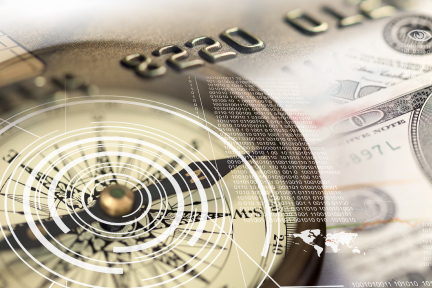 Picture of a credit card overlaid on a compass
