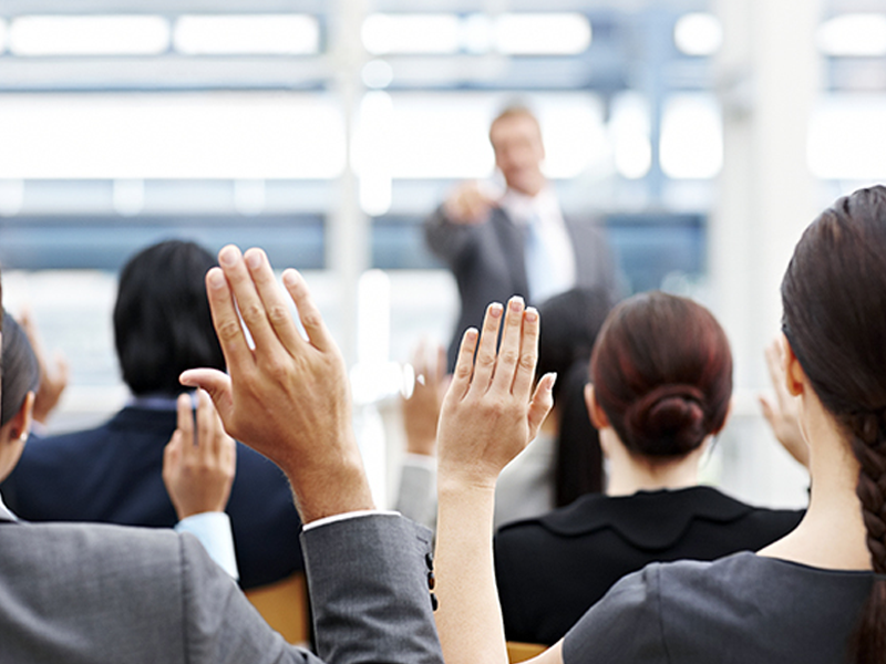 Picture of businesspeople raising their hands