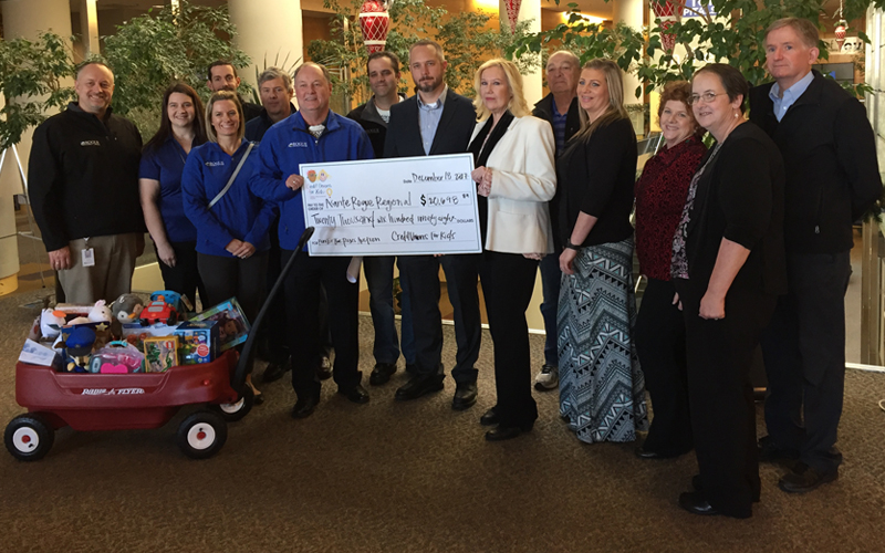 Picture of Rogue Credit Union group presenting hospital with check