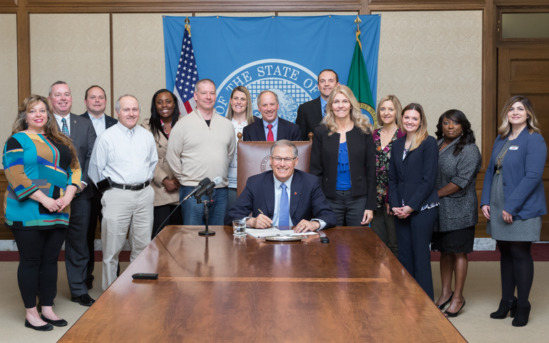 Picture of Gov Inslee HB 2057 bill signing