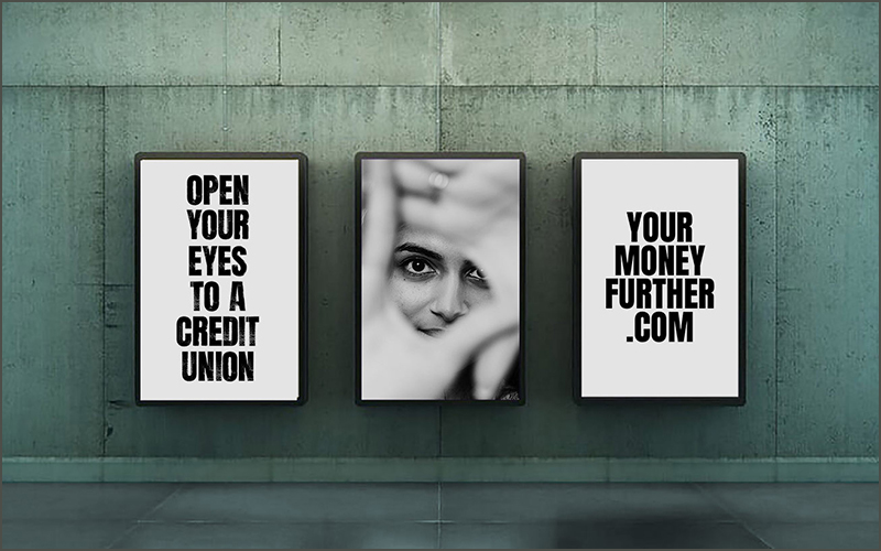 Three Open Your Eyes campaign posters in mock subway tunnel
